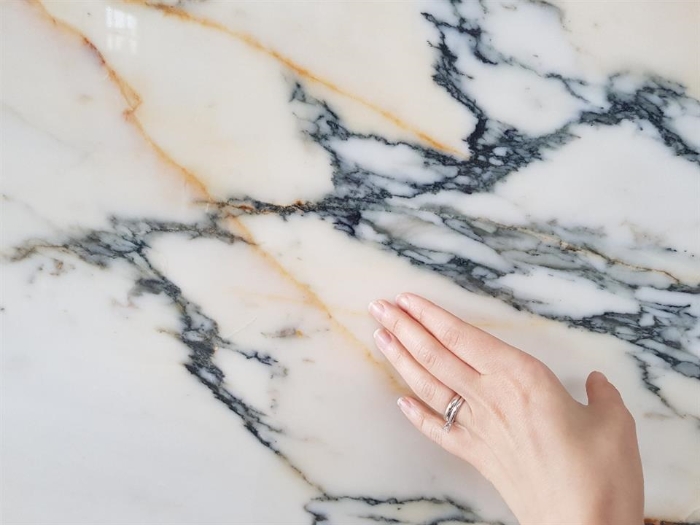 A close-up shot of a veined marble countertop showcasing intricate patterns